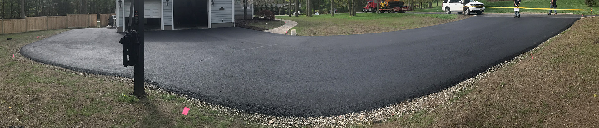 home driveway with fresh asphalt