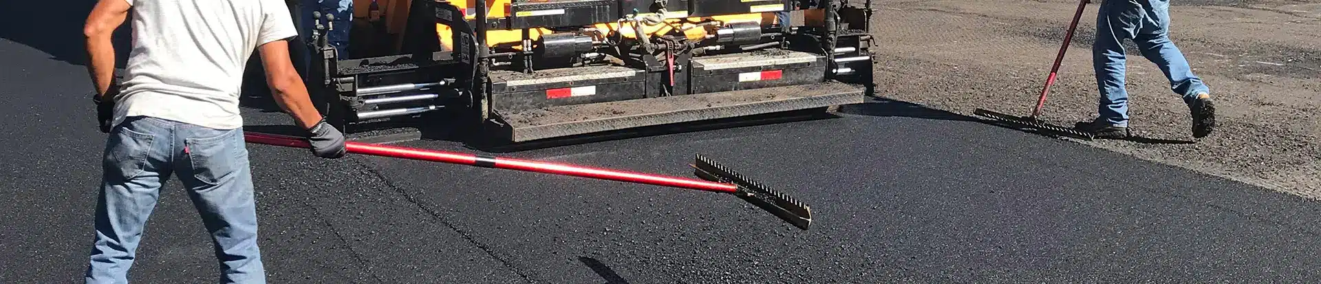 a macchione brothers employees working on asphalt
